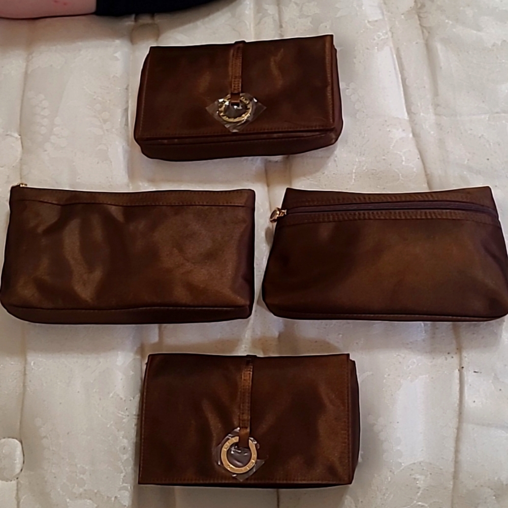 Set of four Bvlgari travel bags